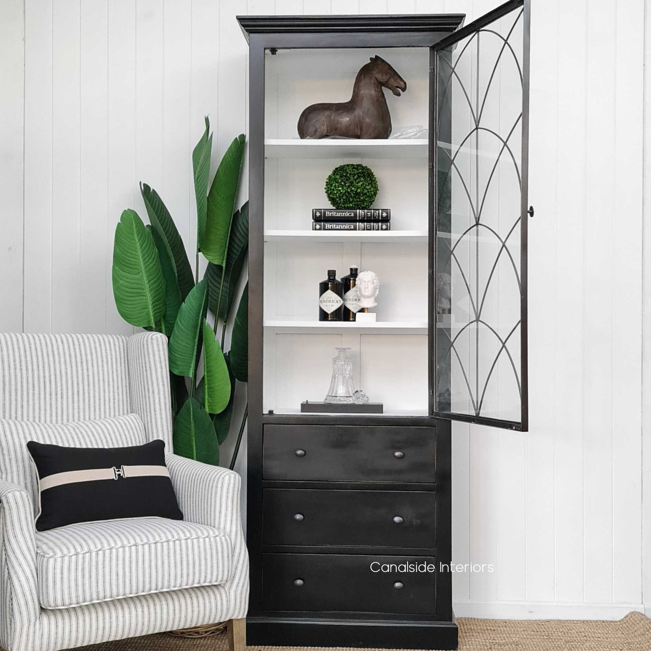 Integrated into a classical study, the cabinet adds a touch of gothic allure, perfect for housing books and collectibles.