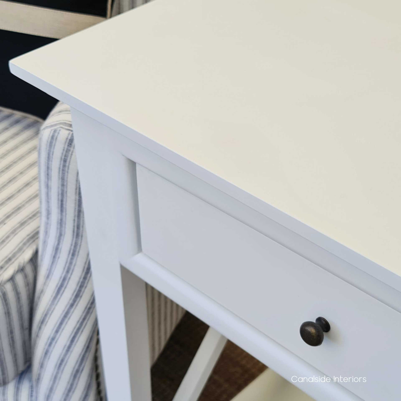 Enhance your dining room's charm with the Hampton Avenue Side Table, featuring elegant cross beam details - Canalside Interiors