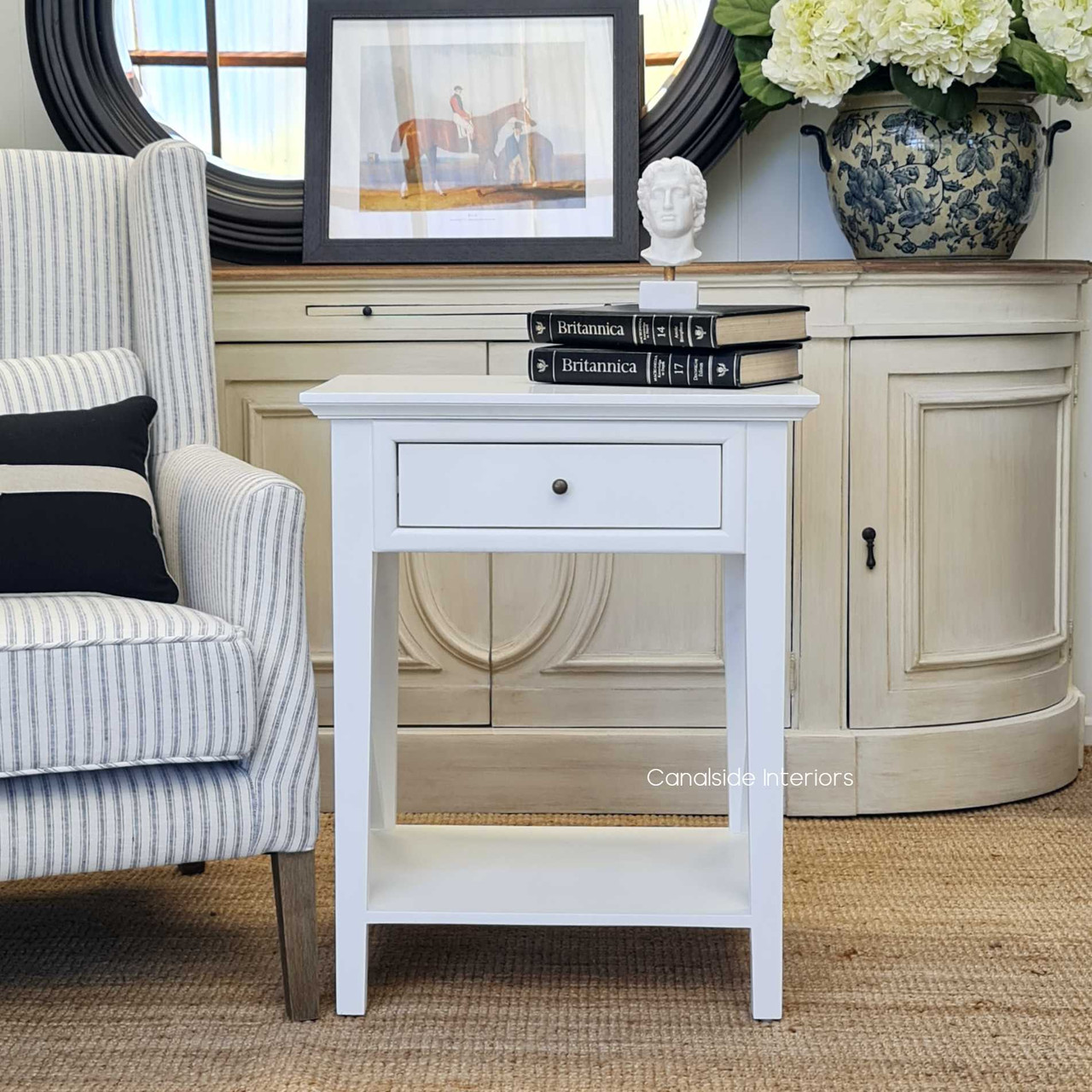 This white bedside table from the Hampton Avenue range is a testament to Canalside Interiors' commitment to quality and modern design