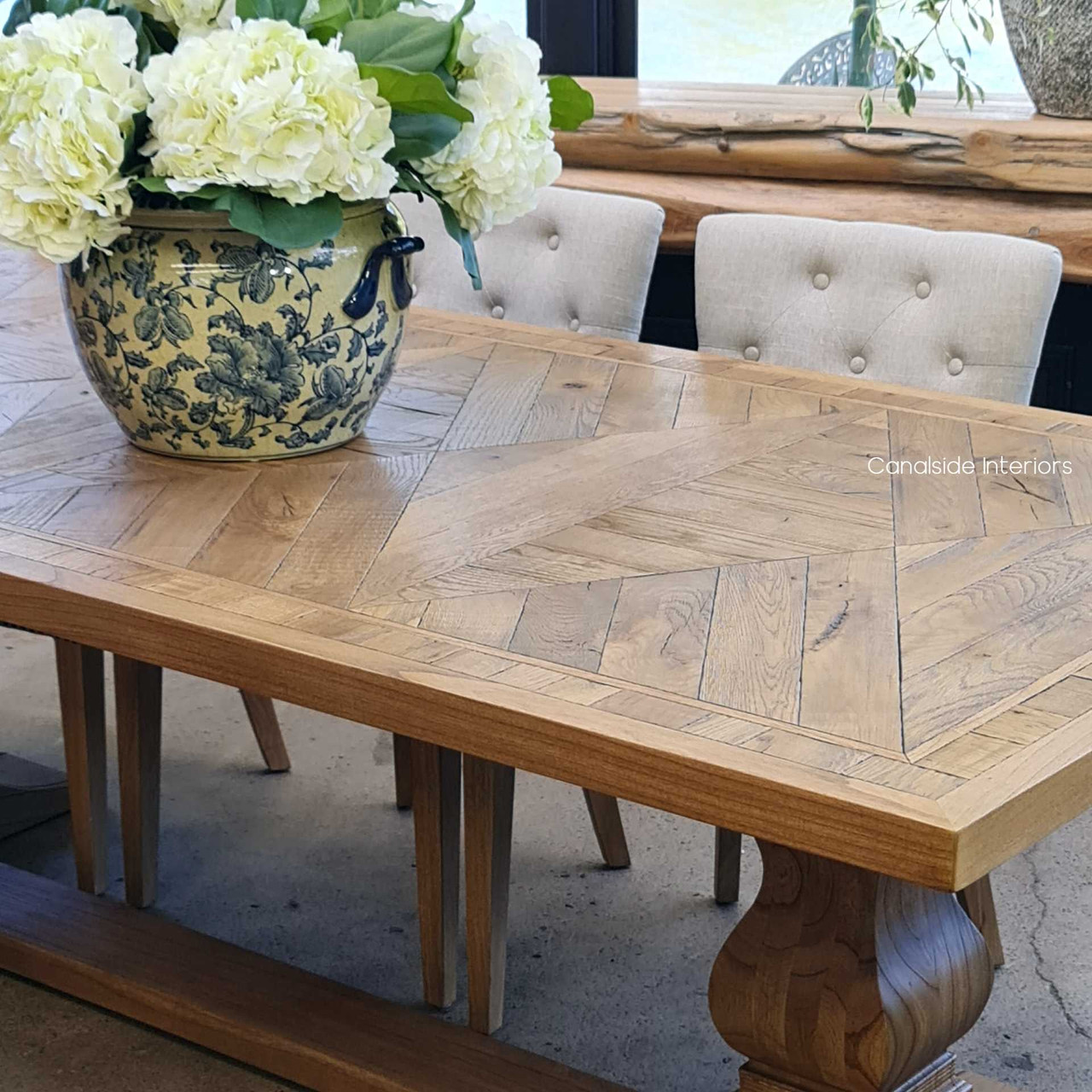 A masterpiece of design, the Danbury Oak Parquetry Dining Table exudes a relaxed yet sophisticated charm, perfect for modern homes seeking a touch of tradition - Canalside Interiors.