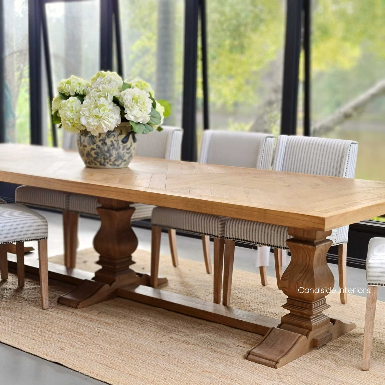 Experience the grandeur of the Danbury Oak Dining Table, suitable for an opulent dining room or library