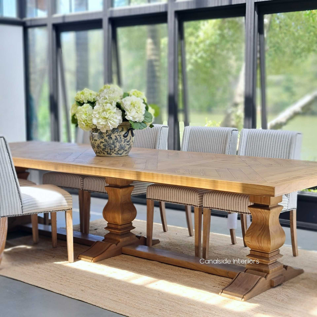 The Danbury Oak Parquetry Dining Table is not just a piece of furniture but a centerpiece of cultural heritage, offering unparalleled style and craftsmanship for discerning interiors - Canalside Interiors