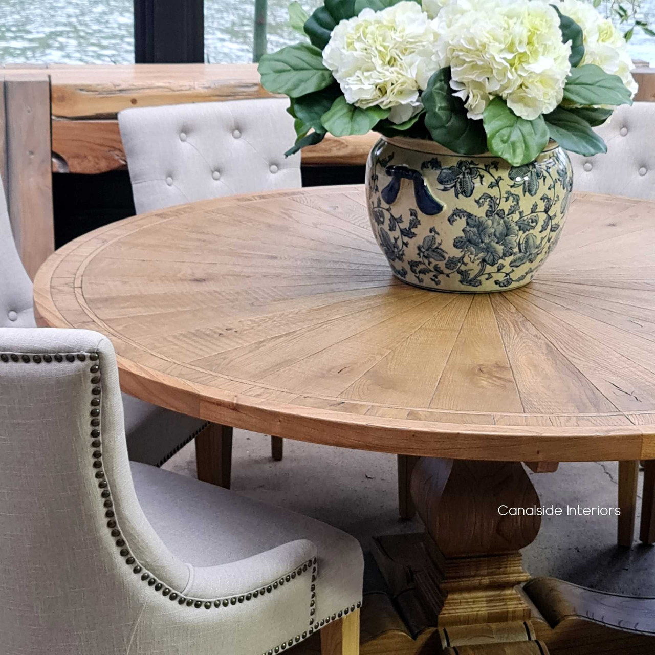 With its grand pedestal and circular form, the Danbury Oak Parquetry Table transforms any dining room into a space of elegance and style, reminiscent of coastal retreats