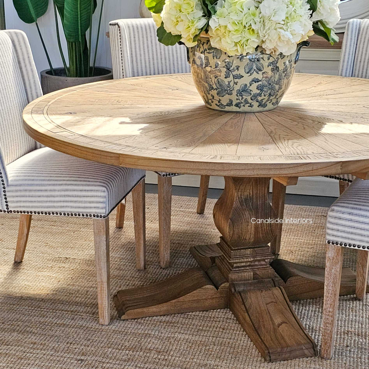 Introduce the allure of the Hamptons into your lounge room with the Danbury Oak Round Table, a symbol of coastal sophistication - Canalside Interiors Sydney