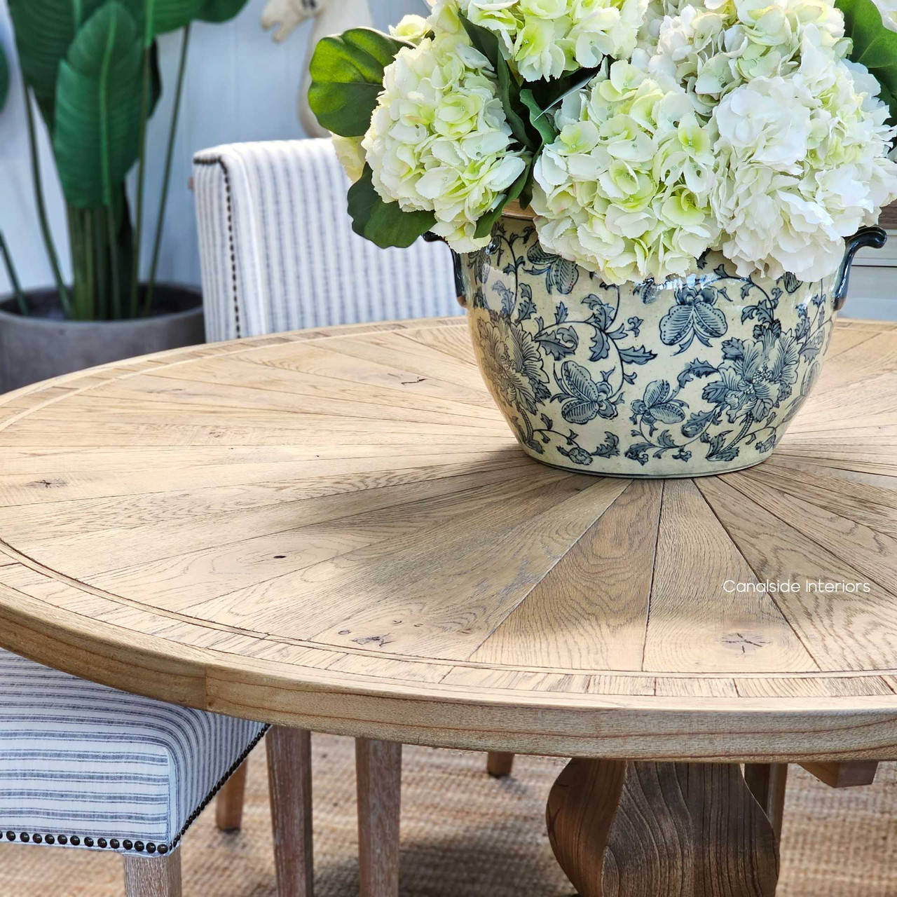 The elegant parquetry of the Danbury Round Dining Table adds a touch of classical beauty to any modern dining setting, blending style and durability - Canalside Interiors Sydney