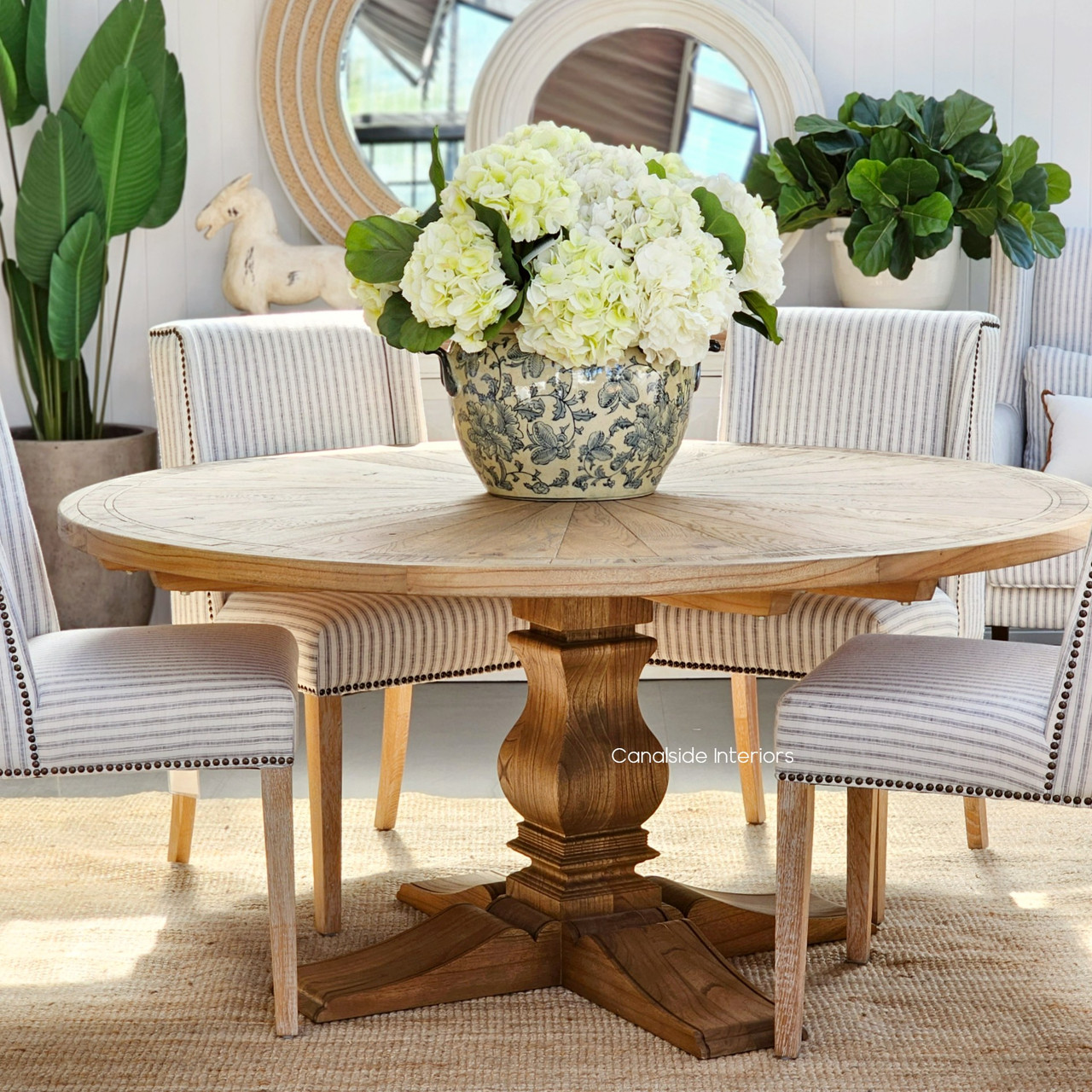 the Danbury Round Oak Table not only serves as a dining area but as an artistic expression in any home, its parquetry top radiating with hand-crafted detail
