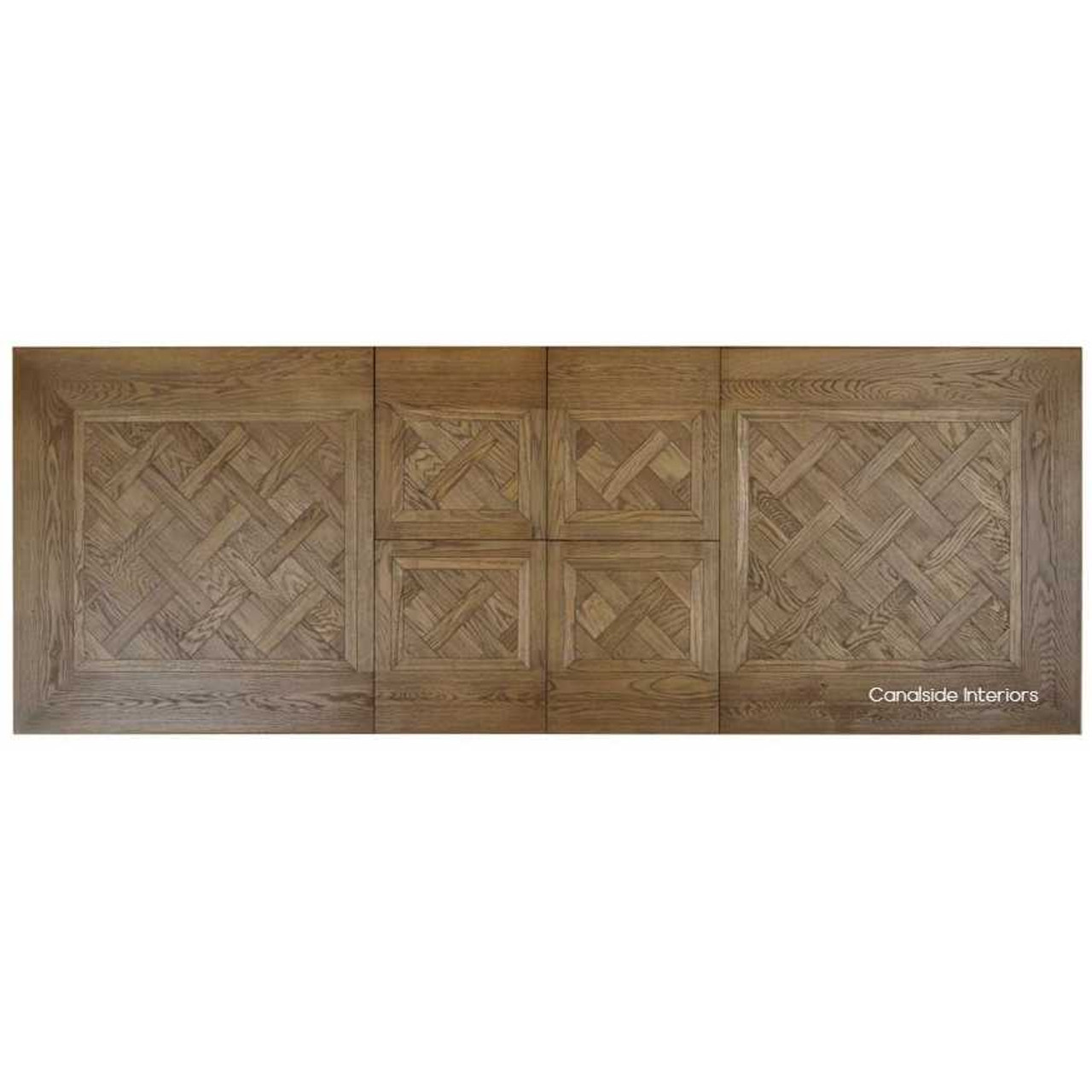 Elevated view capturing the table's opulent design and the seamless integration of its double extension feature for larger gatherings.