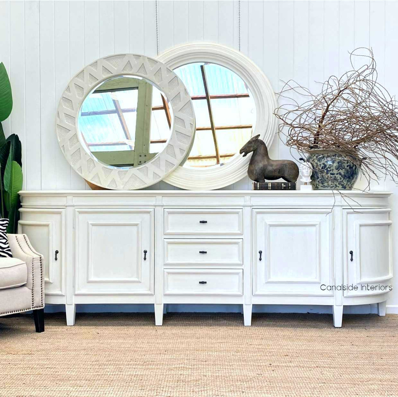Enhance the functionality and style of your library with the Francia Grande Sideboard in distressed white, a perfect blend of modern storage and traditional charm from Canalside Interiors