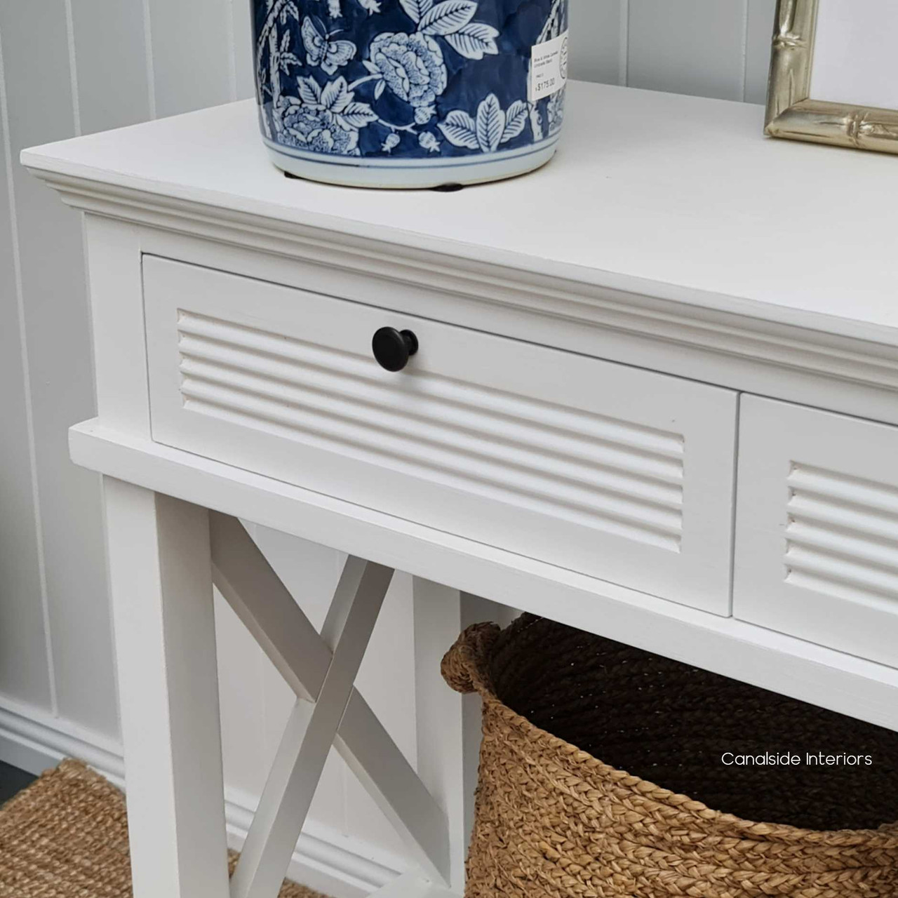 Transform your entryway with the Catalina Console's 'Cross' motif and provincial charm, a signature piece from Canalside Interiors