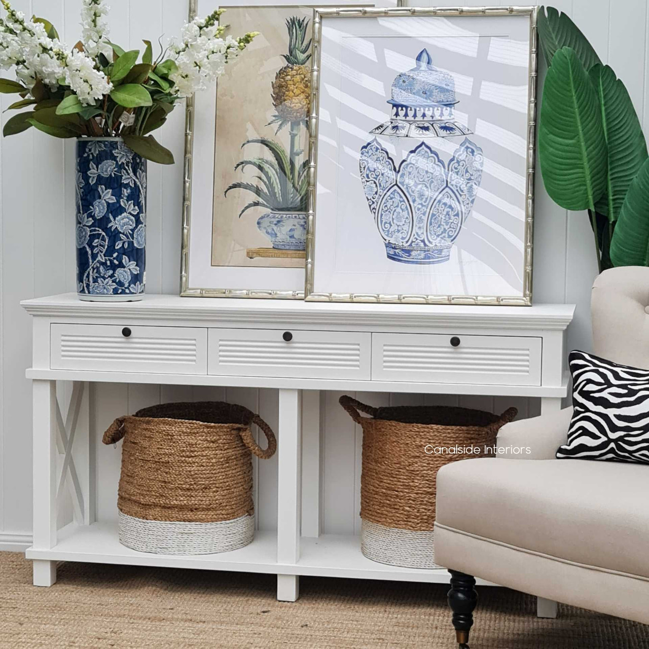 Perfectly suited for library elegance or a home office, the Catalina Console in distressed white enhances any space with a coastal vibe