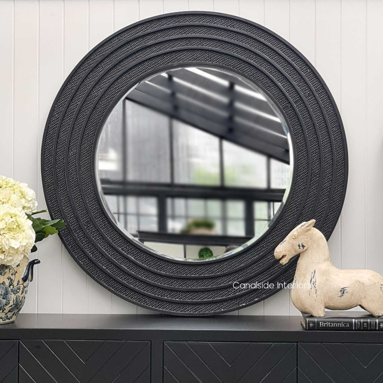 Angled perspective showing the depth and texture of the distressed/charcoal rattan pattern, adding sophisticated island elegance to any room.