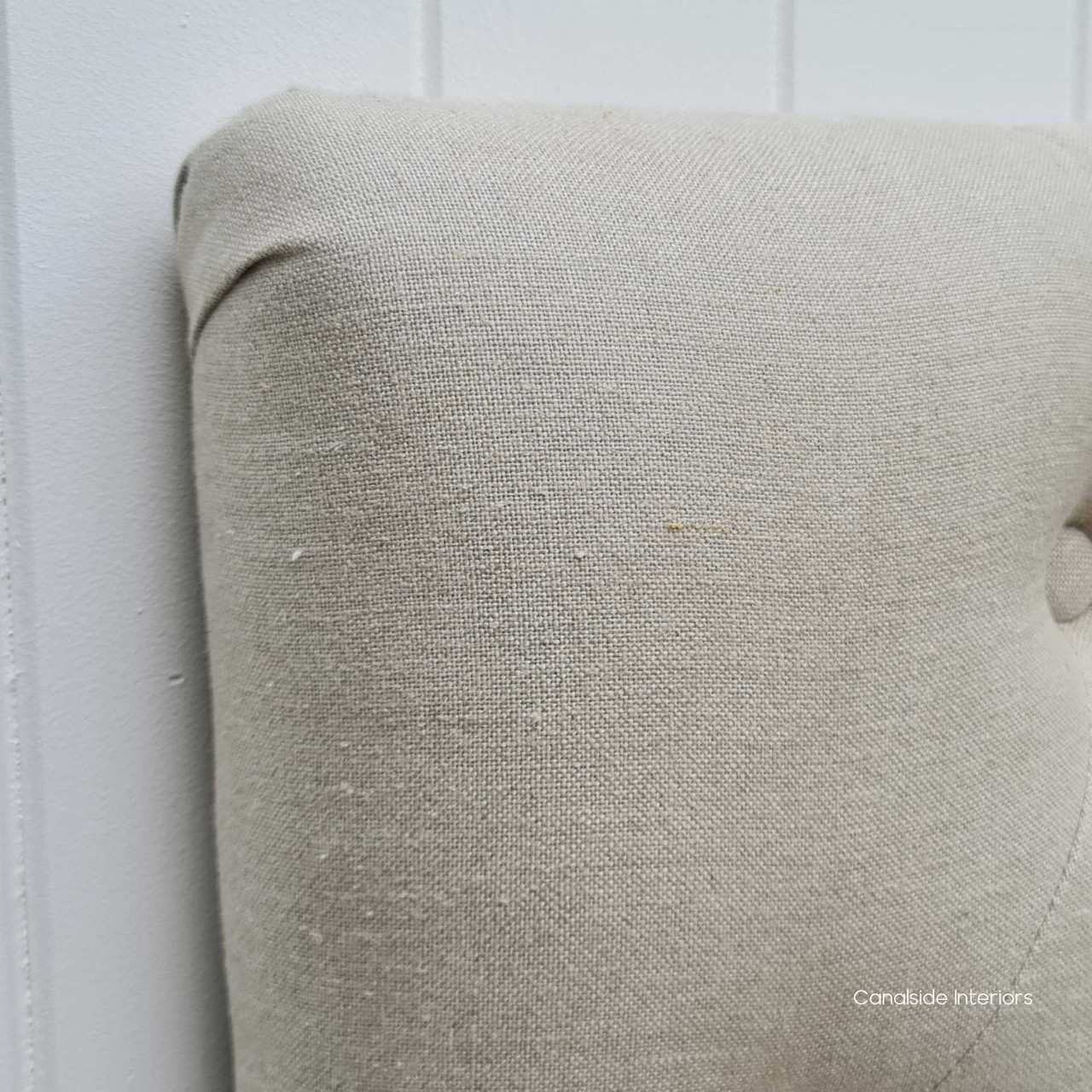 A detail of the Euston Headboard's tufting, embodying the essence of coastal chic in a quality bedroom ensemble - Canalside Interiors