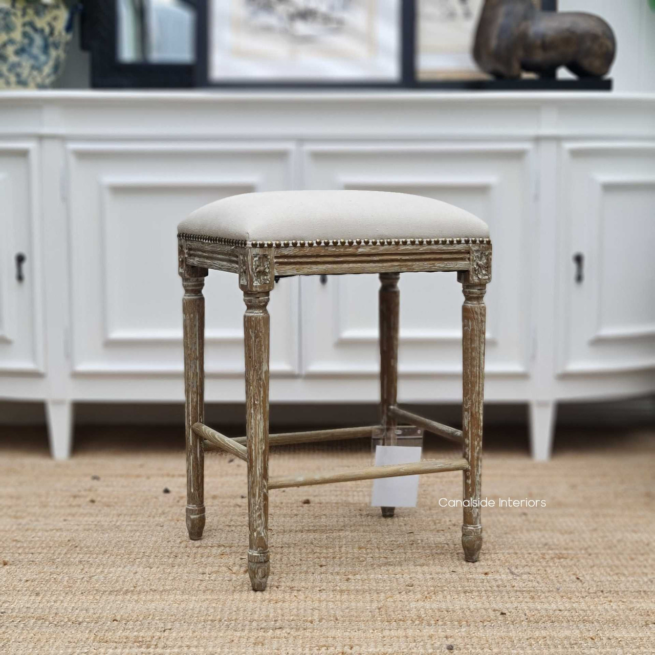 Experience quality and style with the Caylee Kitchen Stool's weathered oak construction, ideal for bringing timeless elegance to any kitchen room