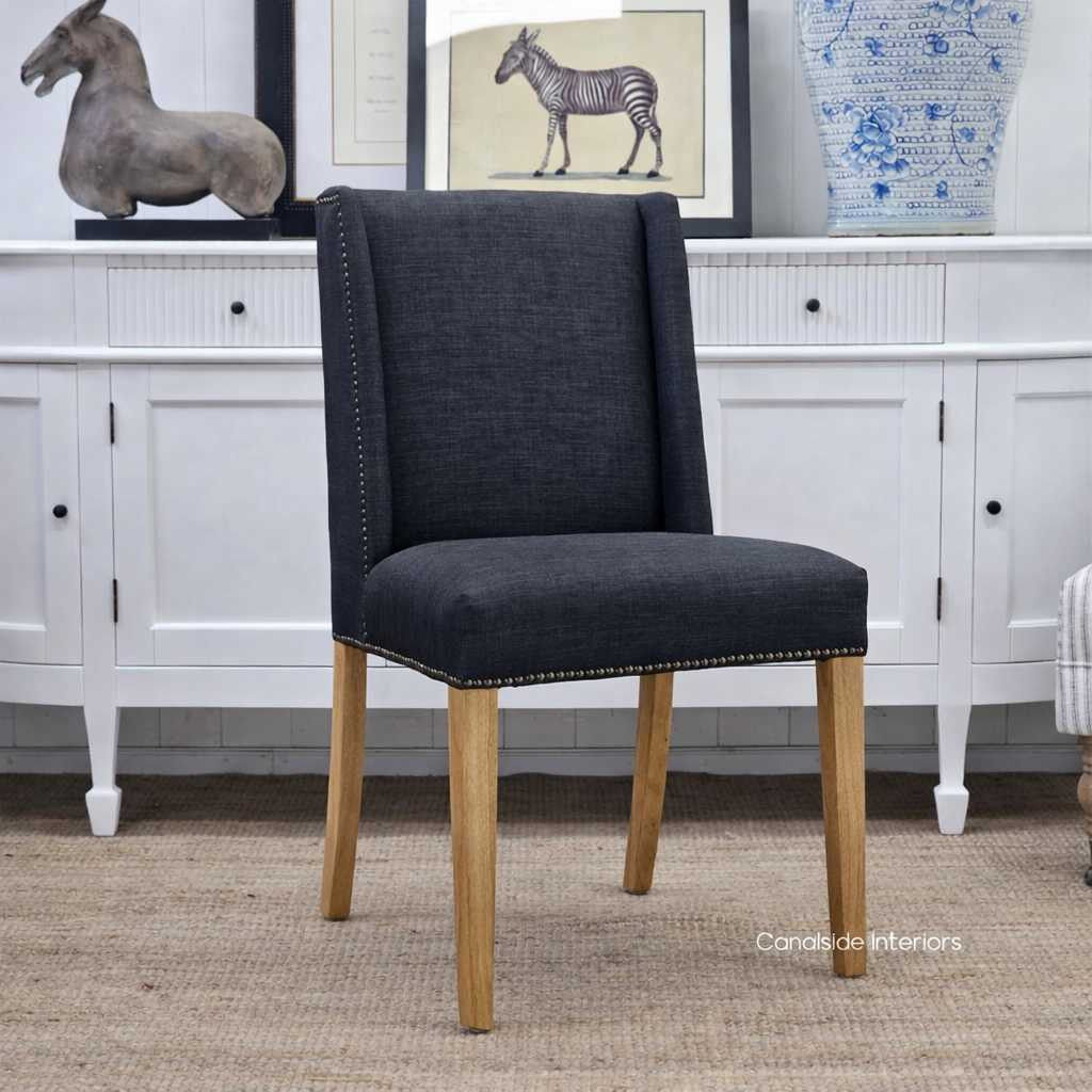 Leclerc Dining Chair, Sleek Sophistication in Black Upholstery, Natural Oak Legs, Brass Stud Detail, Front Angled View