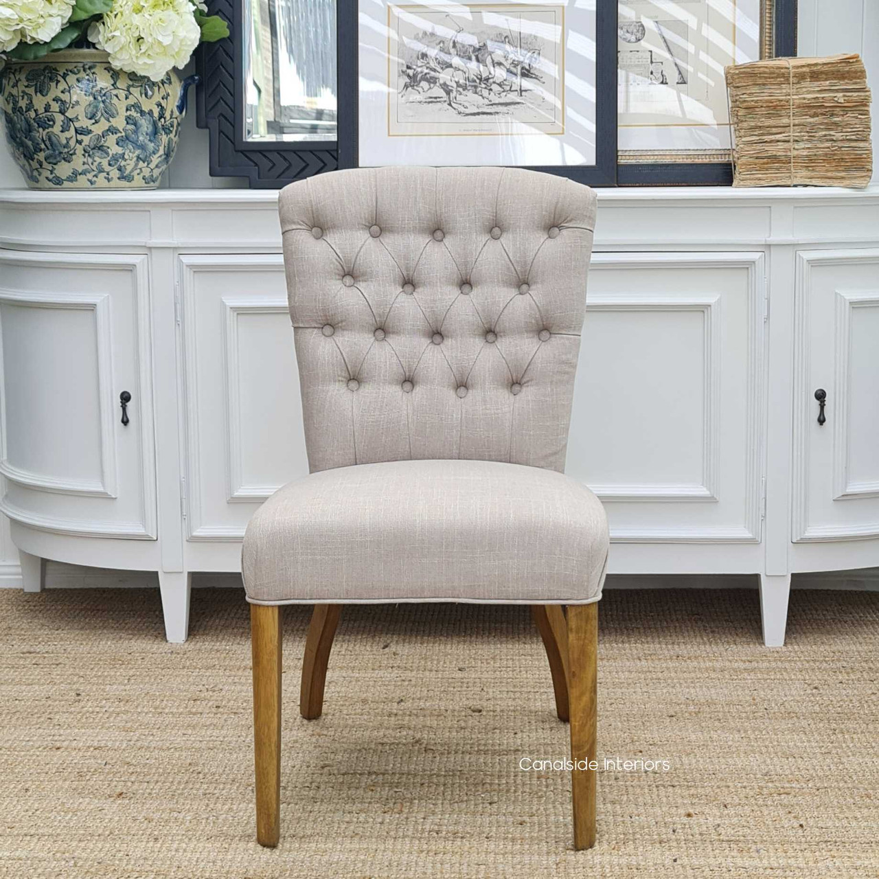 Sophisticated and timeless, the Chelsea Buttoned Back Chair in cream is perfect for elevating the style of any modern dining room - Canalside Interiors
