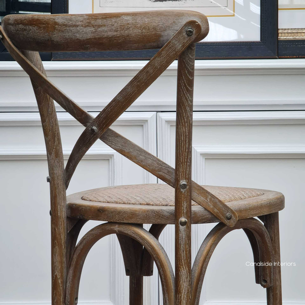 Quality craftsmanship shines in these cafe chairs made of oak, bringing timeless beauty to dining spaces, by Canalside Interiors.