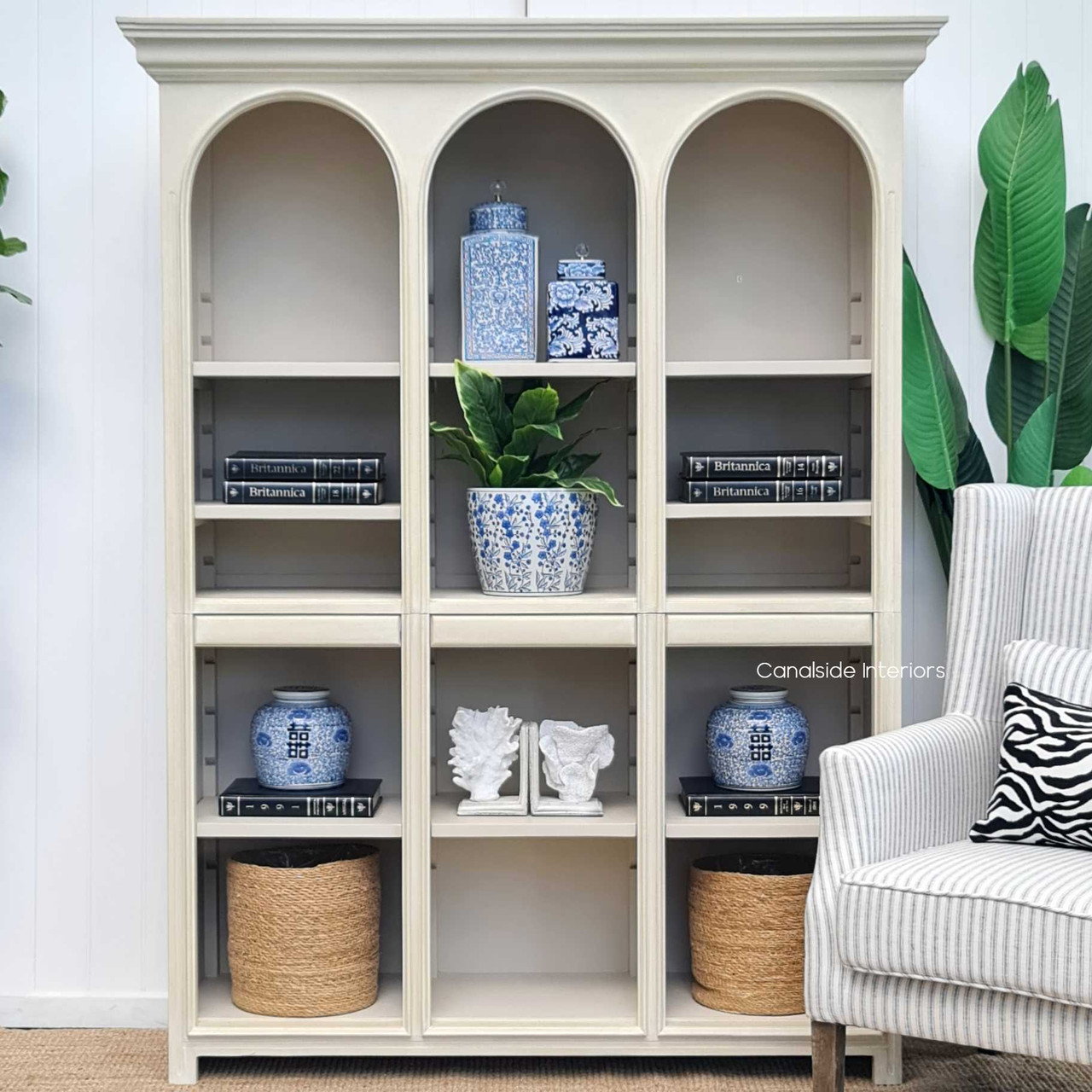 The Biblioteque Open Bookshelf's seamless integration into a coastal chic bedroom, its distressed look complementing the tranquil environment