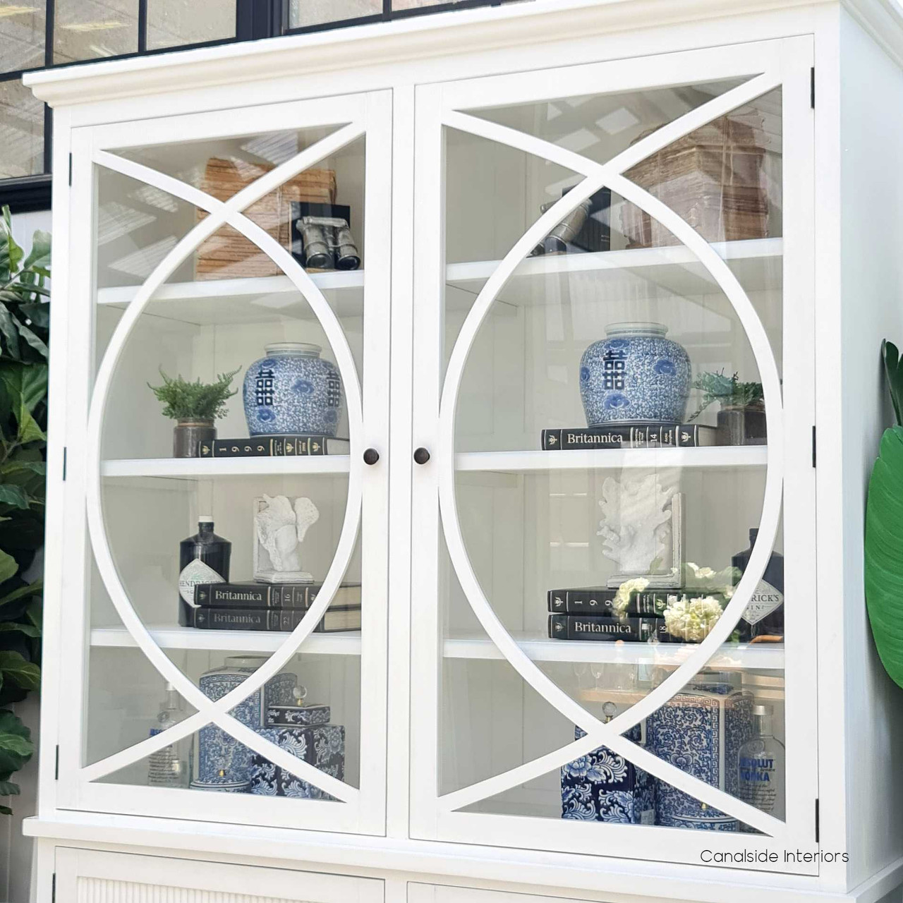 Detailed shot of the Riviera Cabinet's curved overlay motif, exemplifying the timeless and classical design for a coastal living room
