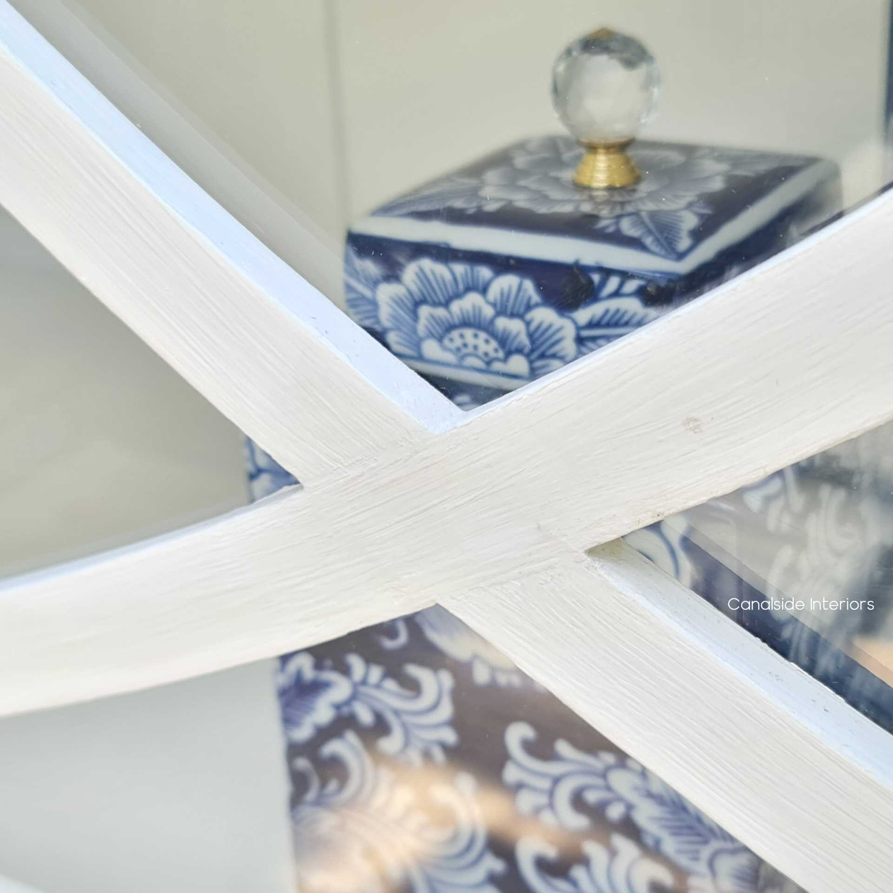 Shot of the Riviera Display Cabinet's open shelving, perfect for storage and display in a refined living room