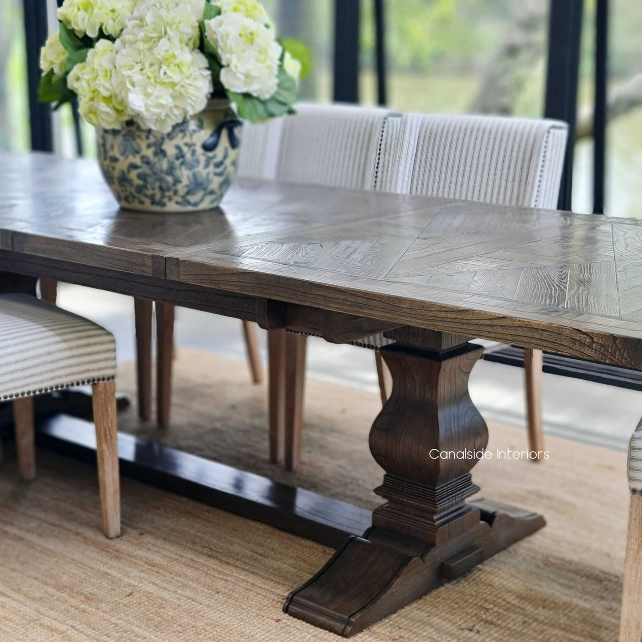 Featuring a unique parquetry top, the Danbury Oak Table in dark espresso finish stands as a centerpiece in Canalside Interiors' array of quality furniture