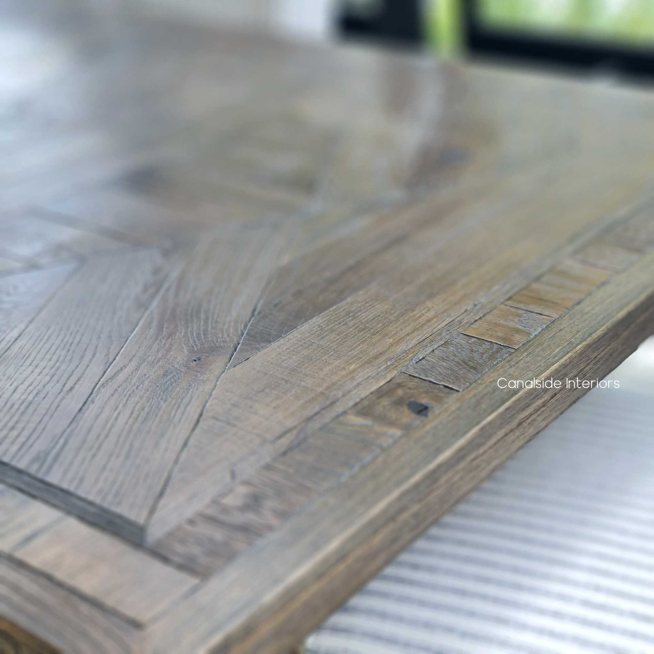 Rich in detail and grand in scale, the Danbury Espresso Oak Extendable Table epitomizes the timeless beauty of parquetry