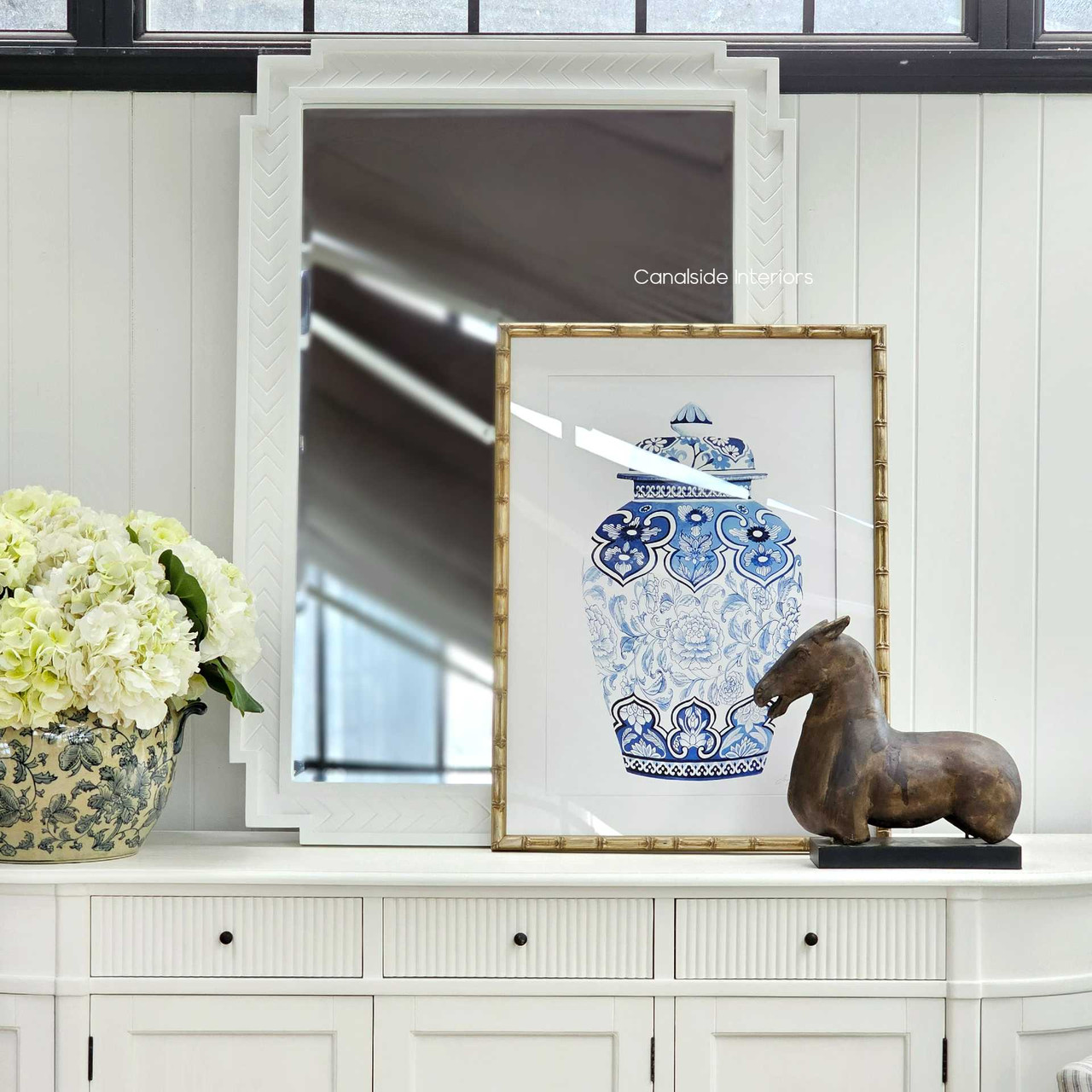 Elegant setup displaying the mirror above a sleek console table, merging classical and contemporary decor.