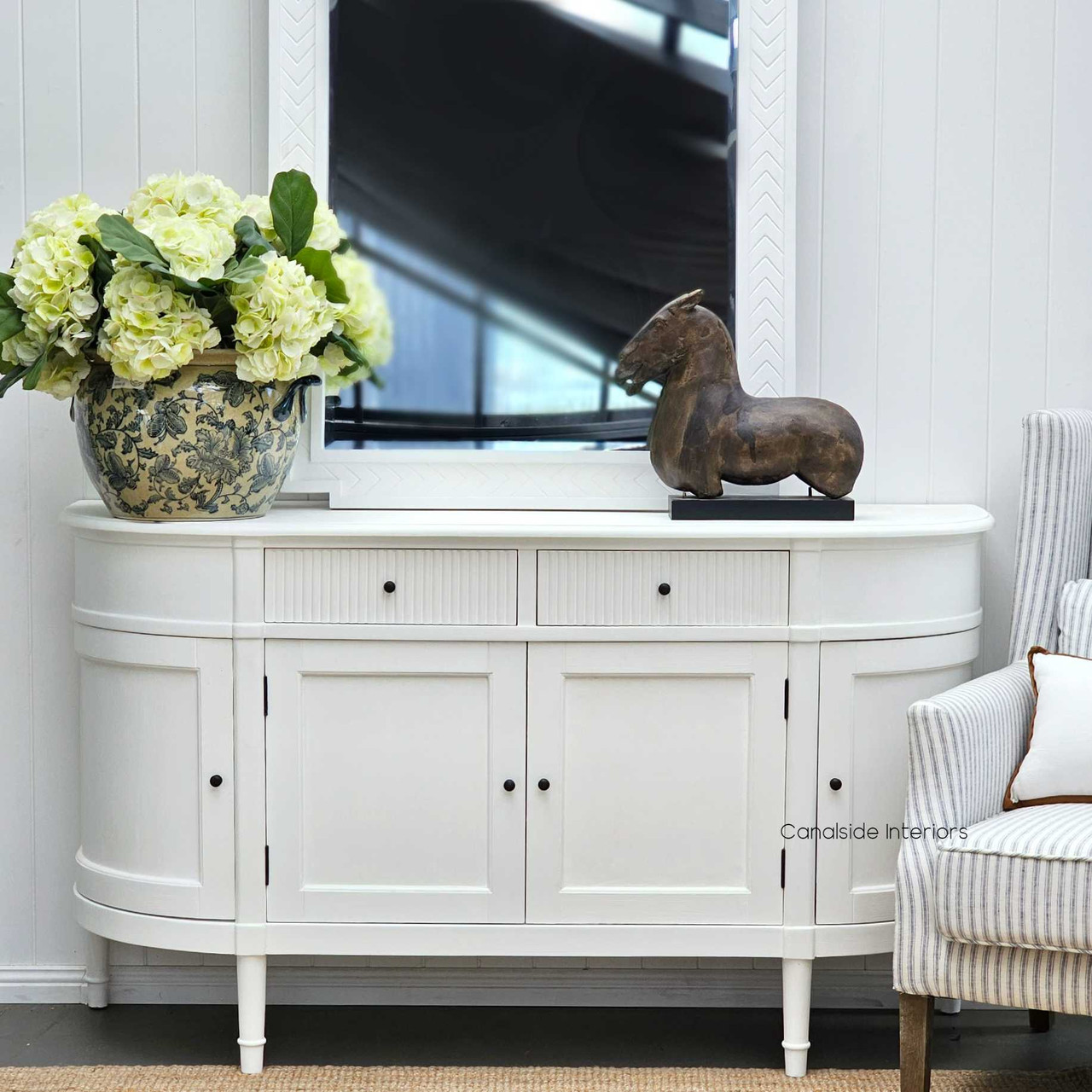 The French Louis Buffet Petite adorned with decorative items, highlighting its spacious surface for showcasing home decor.