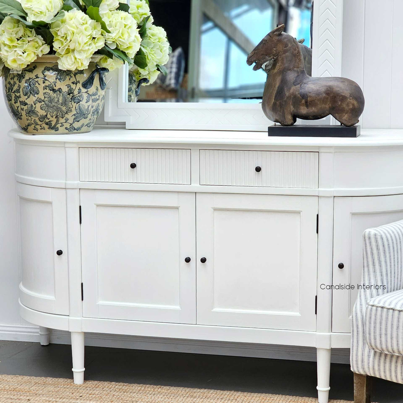 A chic bedroom featuring the French Louis Buffet Petite as an elegant storage piece, demonstrating its adaptability across various room settings.