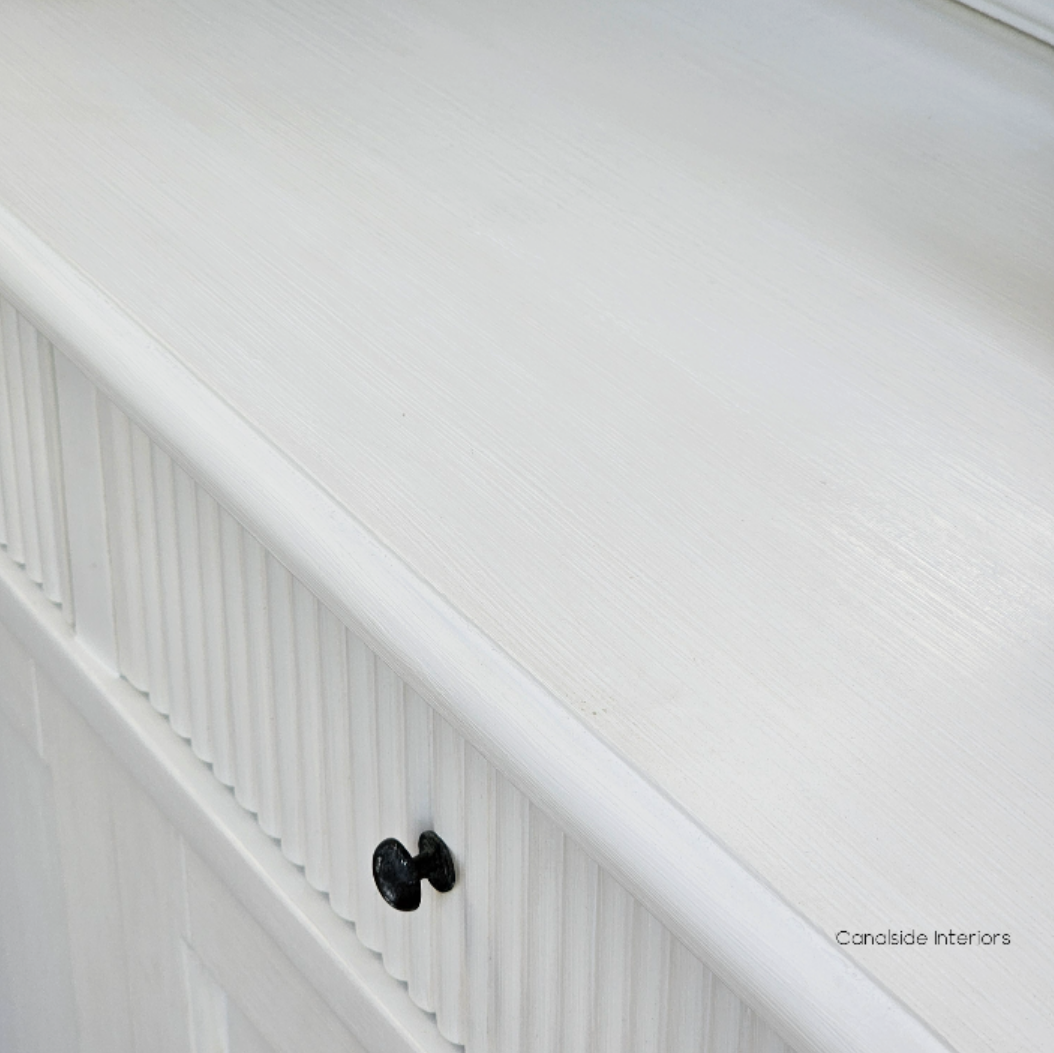 A detail shot emphasizing the precise craftsmanship of the French Louis Buffet Grande, from its classic lines to its modern distressed finish - Canalside Interiors.