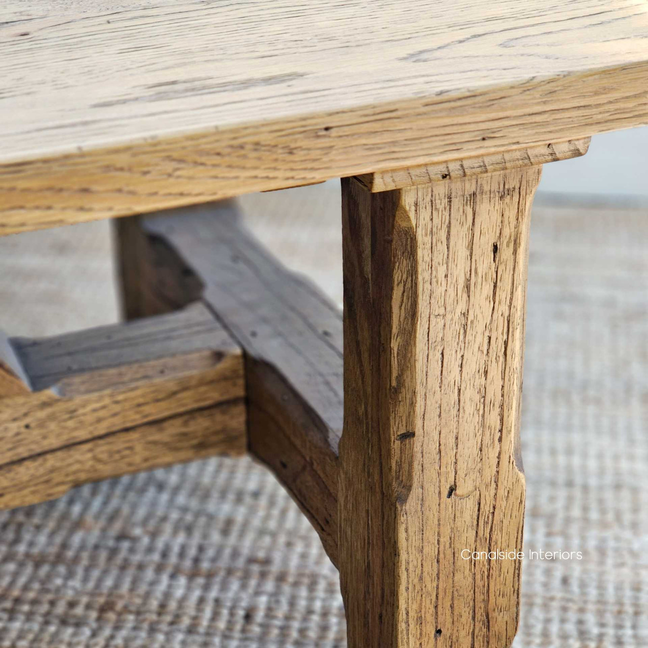 Detailed perspective of the Treadstone Table's sturdy leg and beam construction, merging traditional elements with modern design