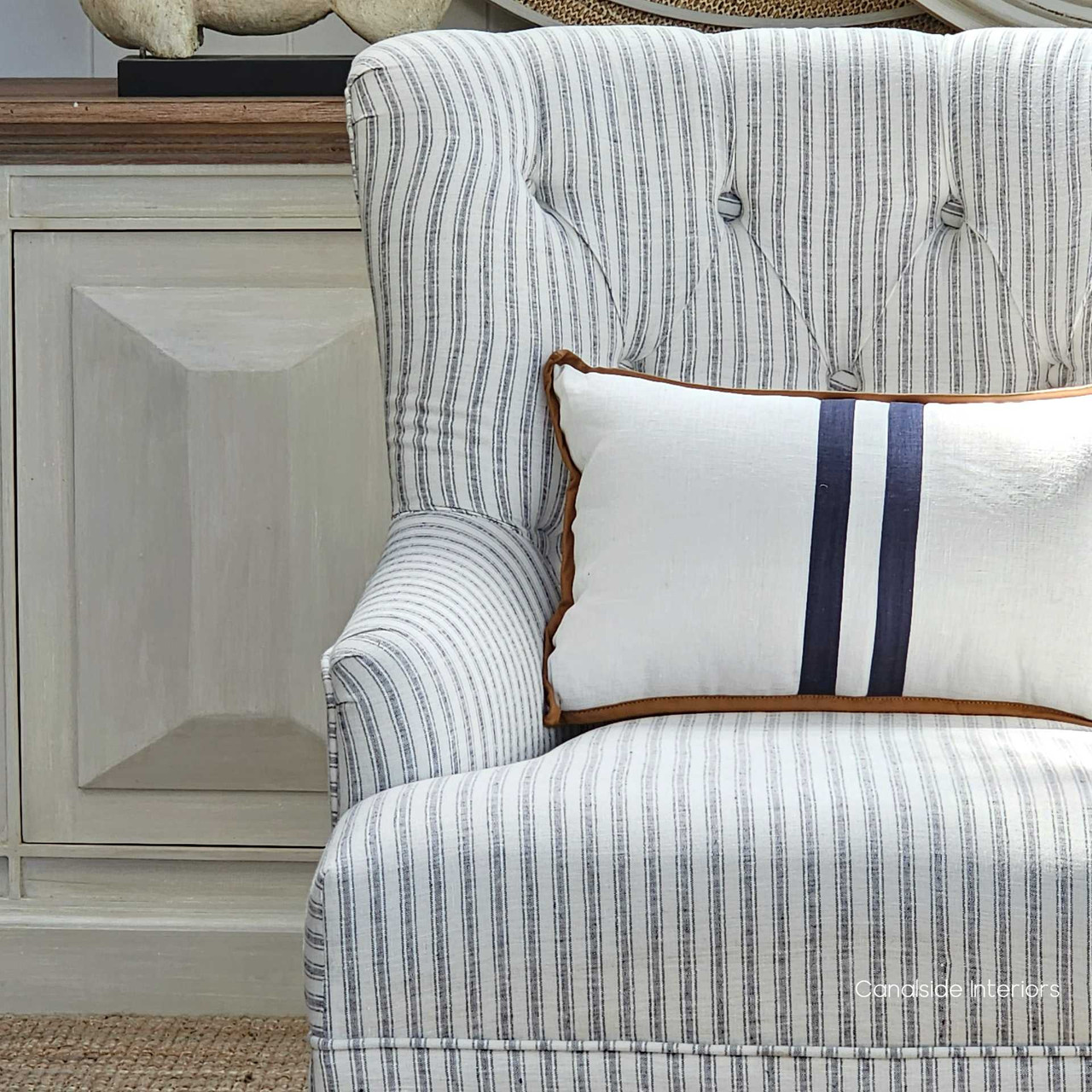 Frontal view of the Ascott Armchair, with its tufted back and comfortable seating, ready to enhance any living space with Canalside Interiors' signature style.