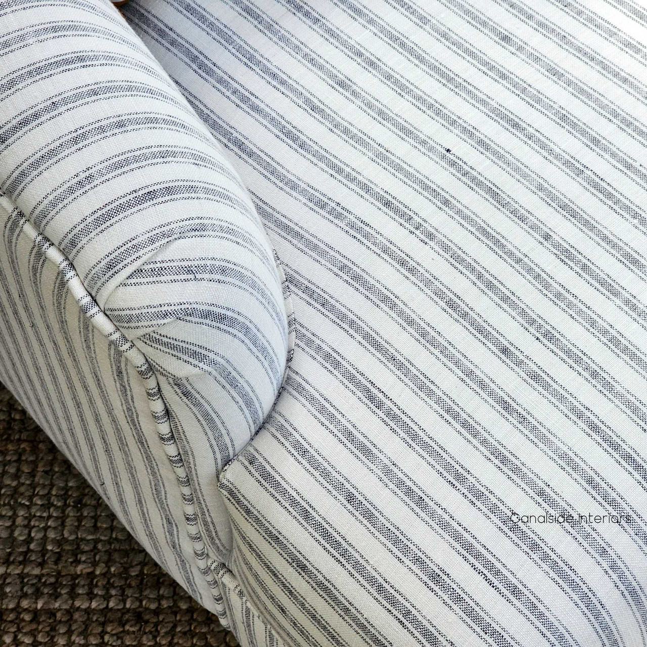 Overhead view of the Ascott Armchair's seat, showcasing the comfort and luxurious texture of the linen blend upholstery