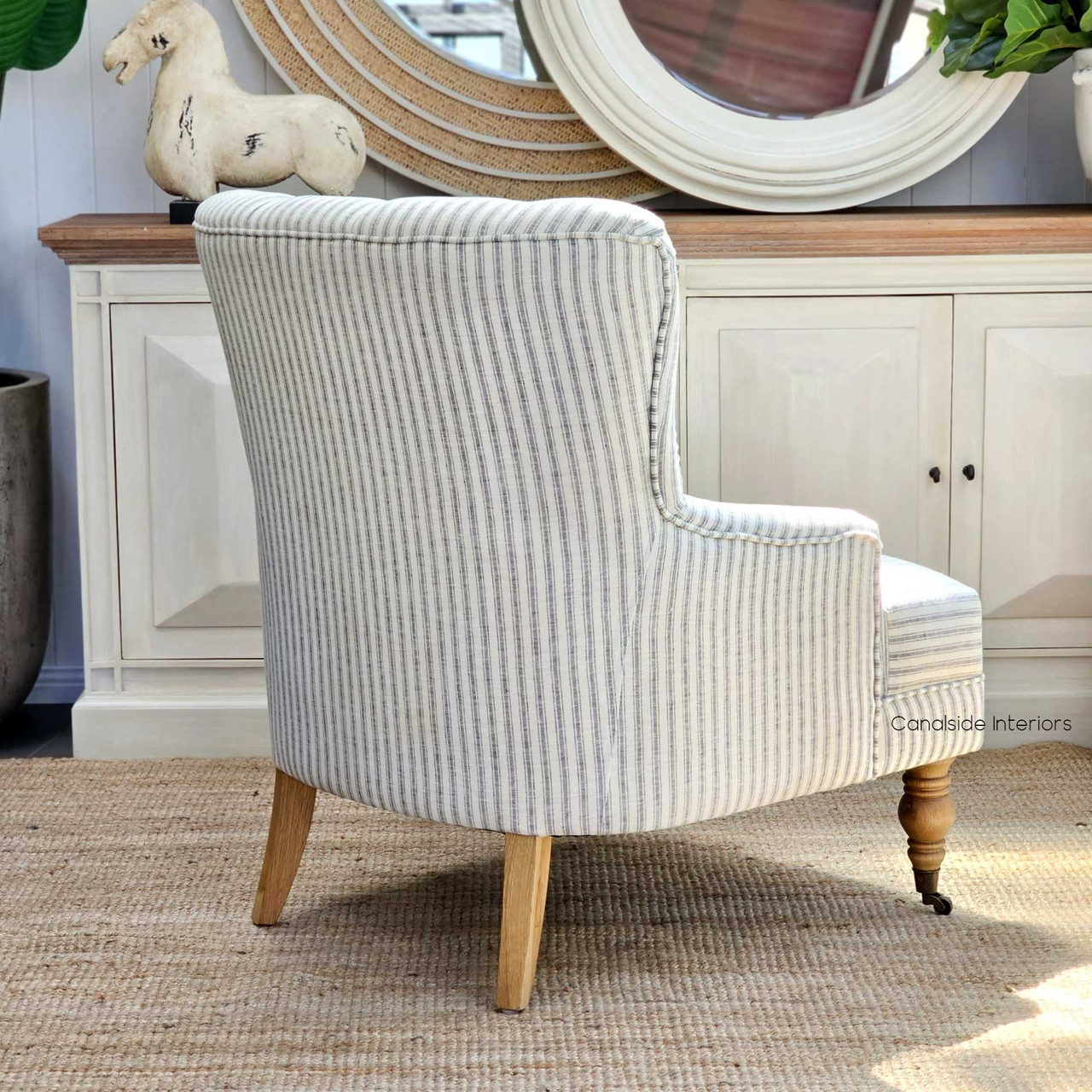 Close-up of the plush tufting on the back of the Ascott Armchair, offering a touch of classical comfort to any home library.