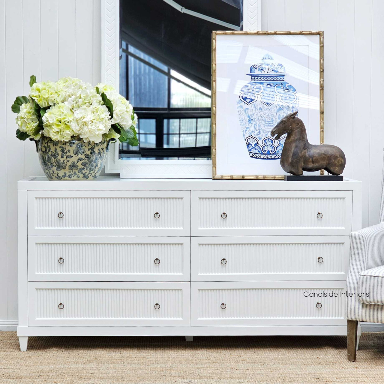 The Grande Drawer Chest detailed with minor distressing, offering a contemporary twist to a classical living room - Canalside Interiors