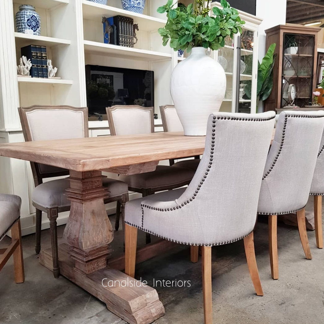 The Artisan Dining Table in a lounge room setting, blending classical elements with a modern aesthetic