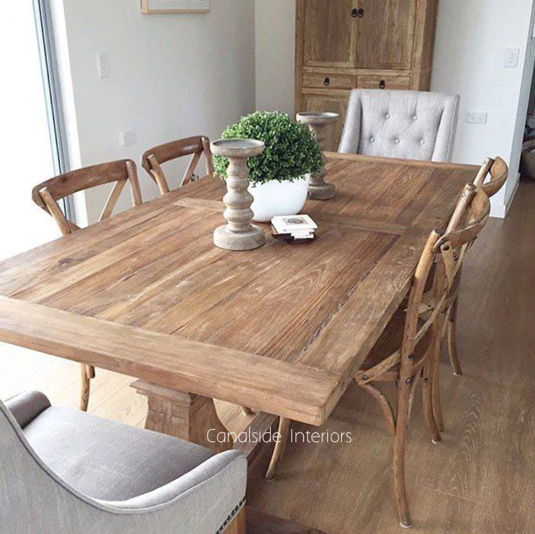 Close-up of the rustic tabletop, highlighting the unique characteristics of the recycled timbers, perfect for family dining
