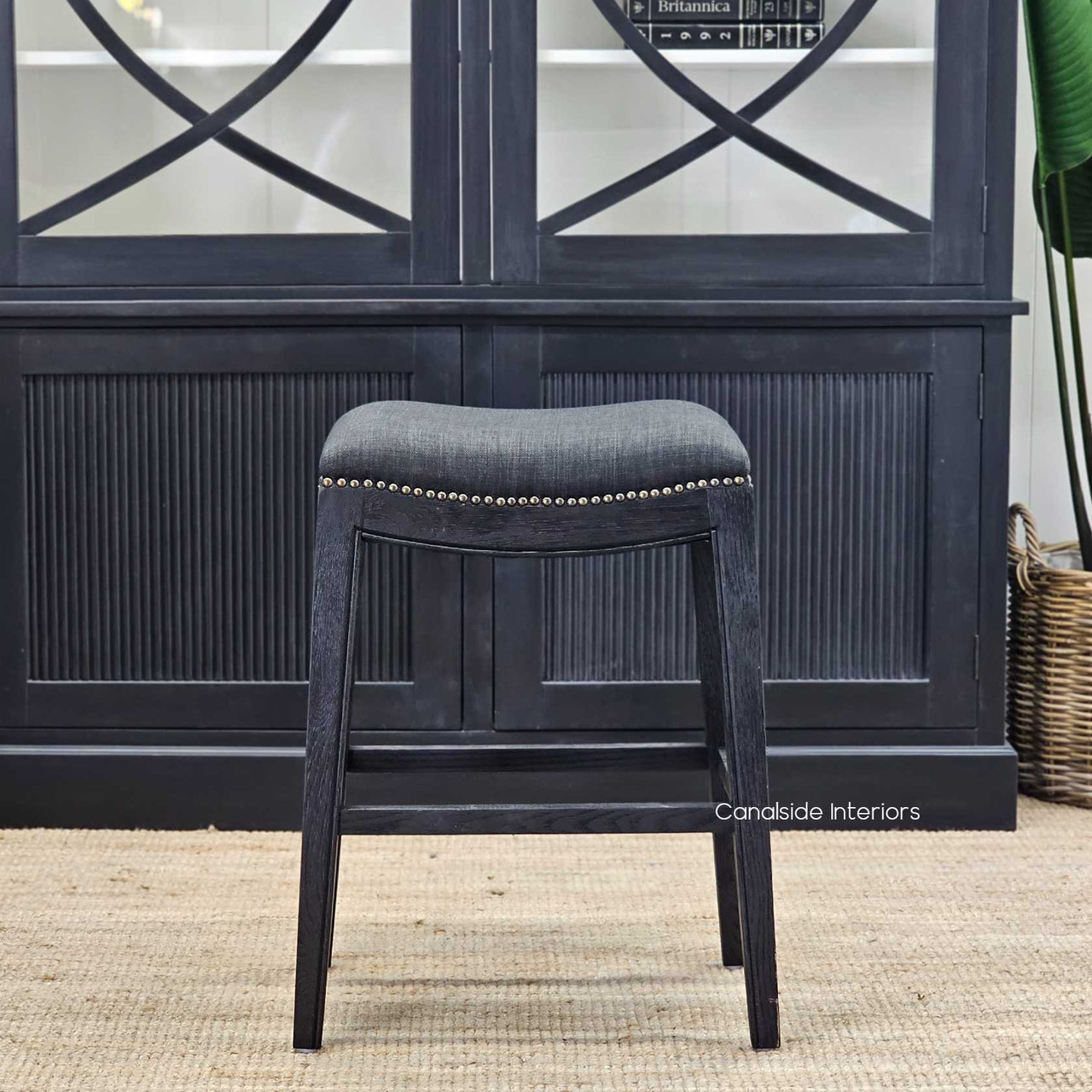 Rear view of the Mila II Bar Stool, displaying the stud accents that complement a Hamptons-style dining area
