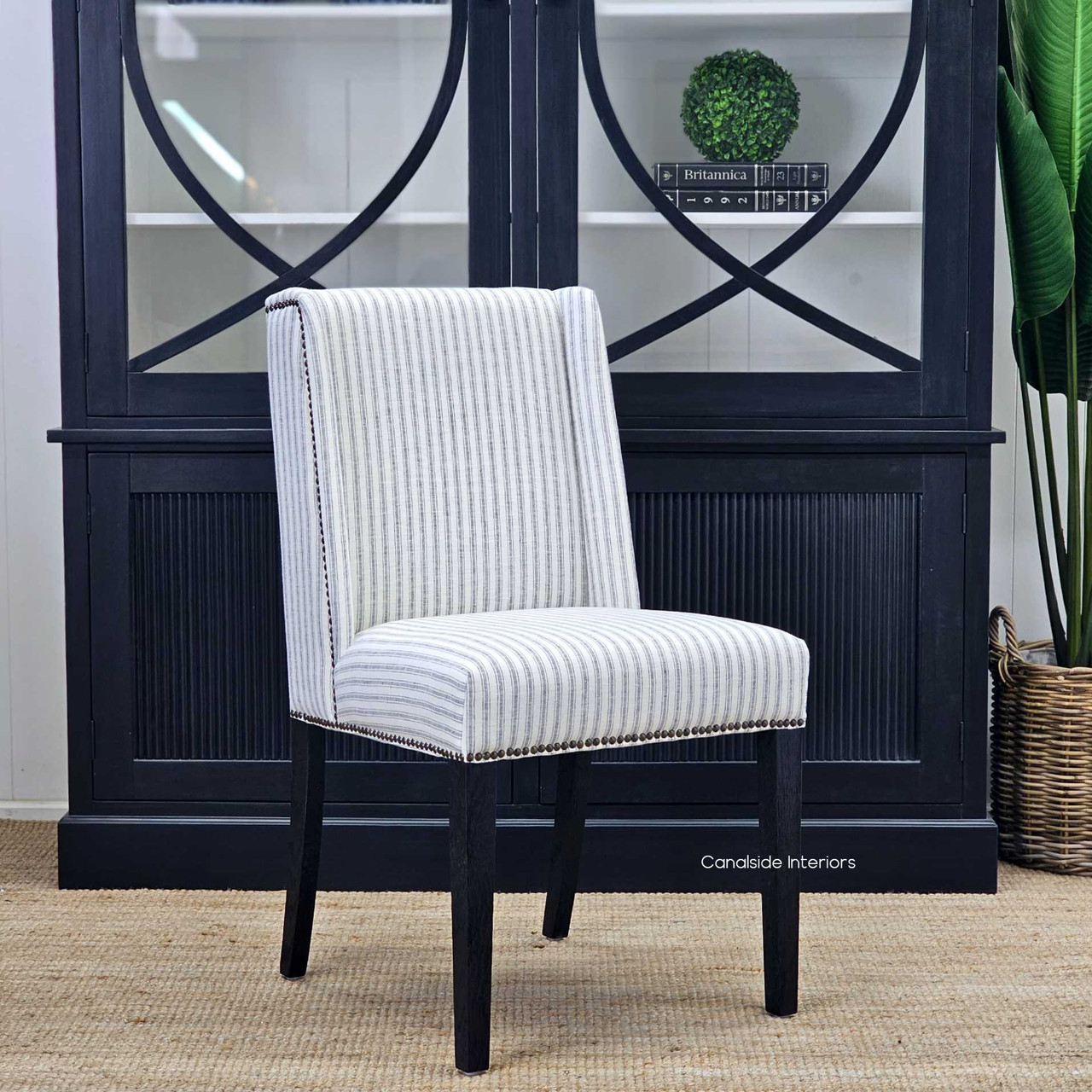 Side view of the Leclerc Dining Chair, with its winged back, offering a sophisticated silhouette for Hamptons-inspired spaces.