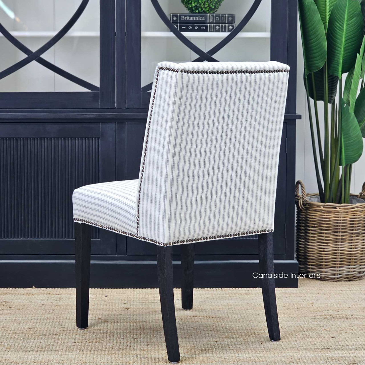 The harmony of blue stripes and black legs on the Leclerc Chair, a testament to timeless design and modern sensibility.