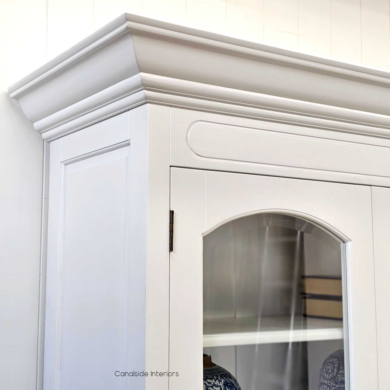Crafted for elegance, the Key Largo Display Unit's white finish and classical lines enhance the storage appeal in a living room