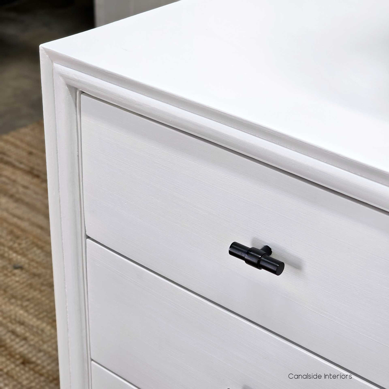 Top view of the Camille Bedside, focusing on the spacious surface perfect for bedroom essentials in a distressed white finish
