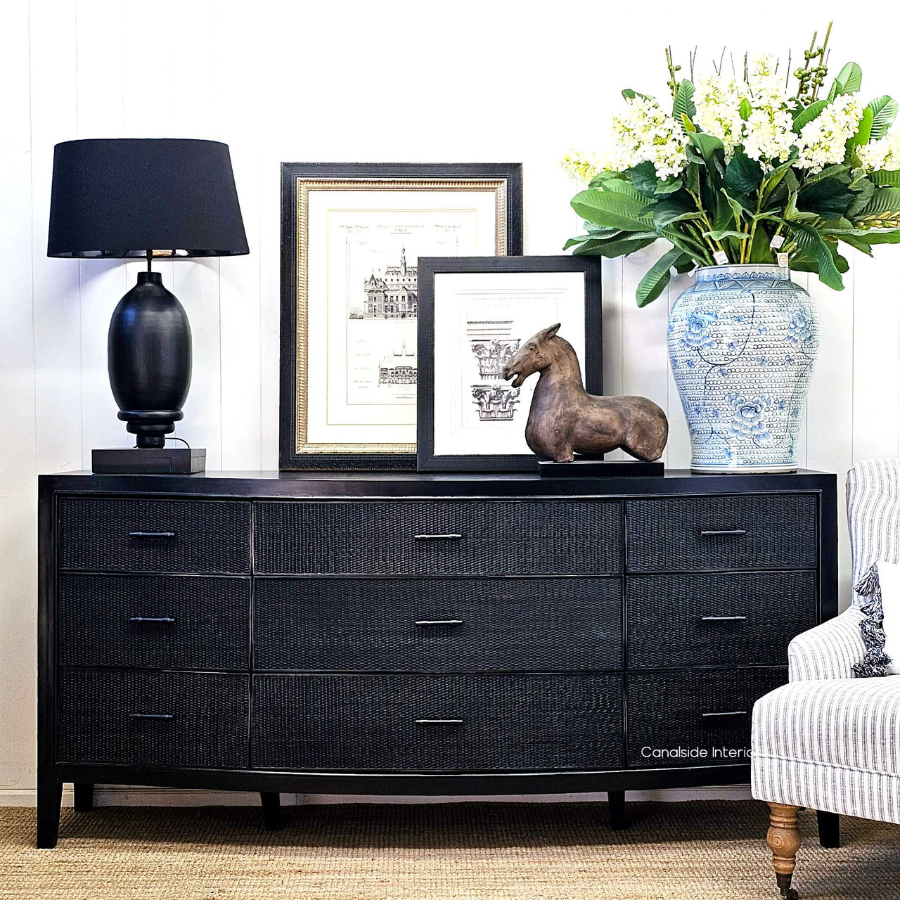 The Claremont Chest, viewed from the front, featuring nine spacious drawers for stylish organization in a bedroom or a living room