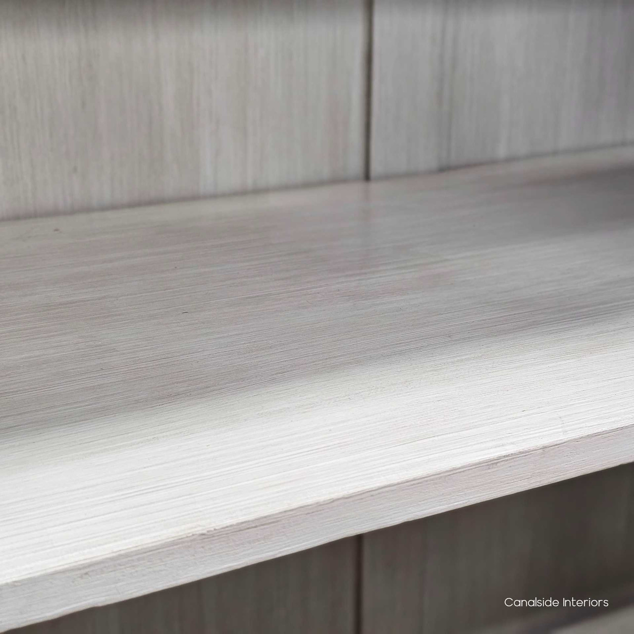 Full view of the Tunbridge Glass Display Cabinet's limewash interior, presenting a perfect canvas for your treasured items in a Hamptons-style lounge room