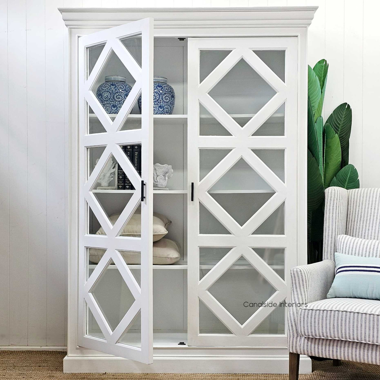 Angled view of the Tunbridge Glass Display Cabinet, showcasing the harmony between functionality and aesthetic appeal in a modern home office