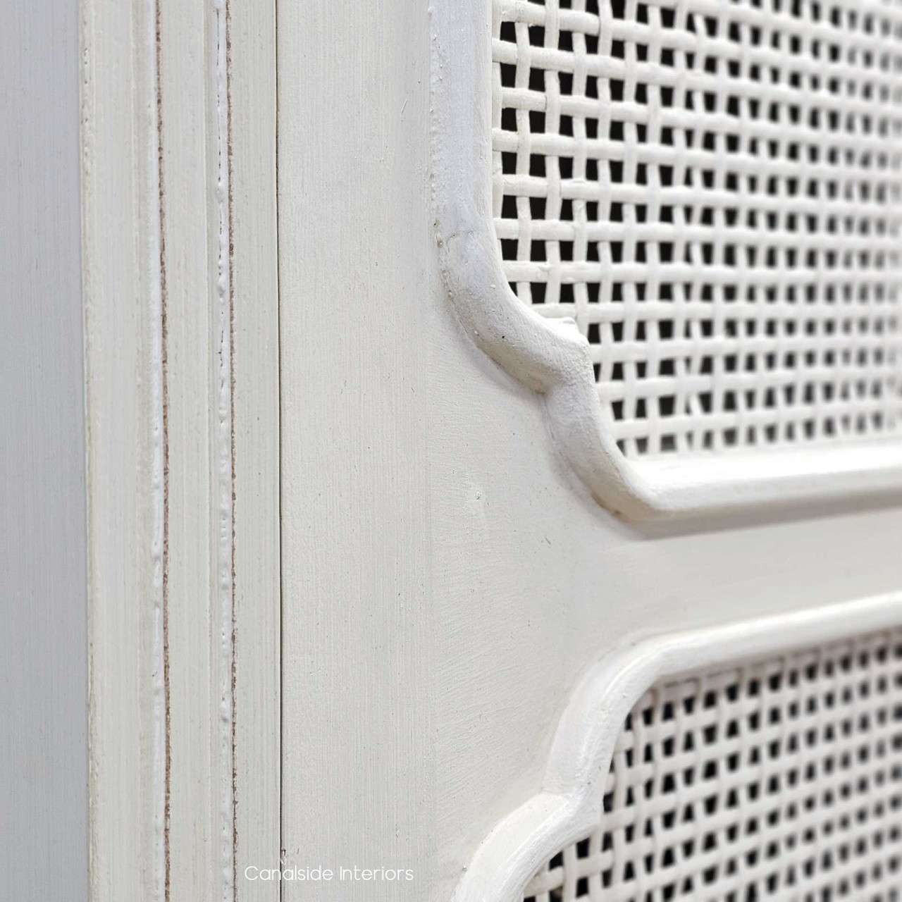 Close-up of the Elendil Rattan Storage Cupboard's distressed stone finish, highlighting the quality craftsmanship and timeless design