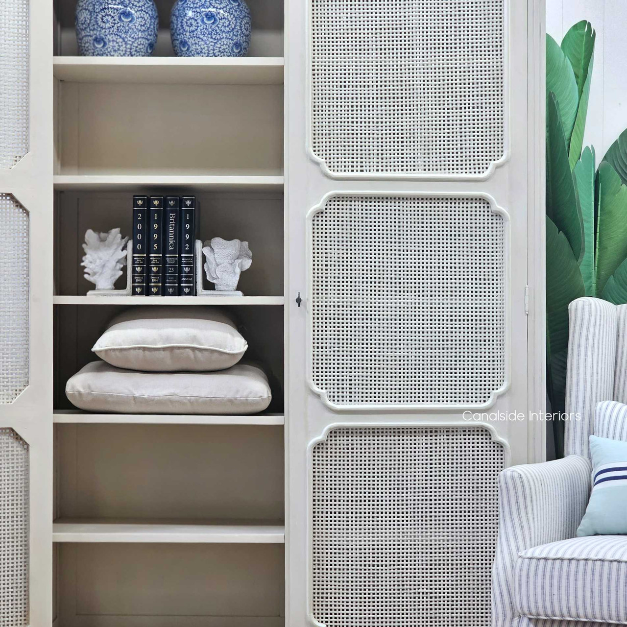 Elendil Rattan Storage Cupboard with doors open, revealing the spacious storage options and removable shelves for versatile organization