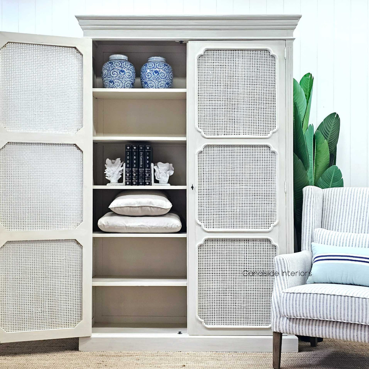 Front view of the Elendil Rattan Storage Cupboard in natural rattan, showcasing its rustic charm and modern Hamptons elegance for Canalside Interiors