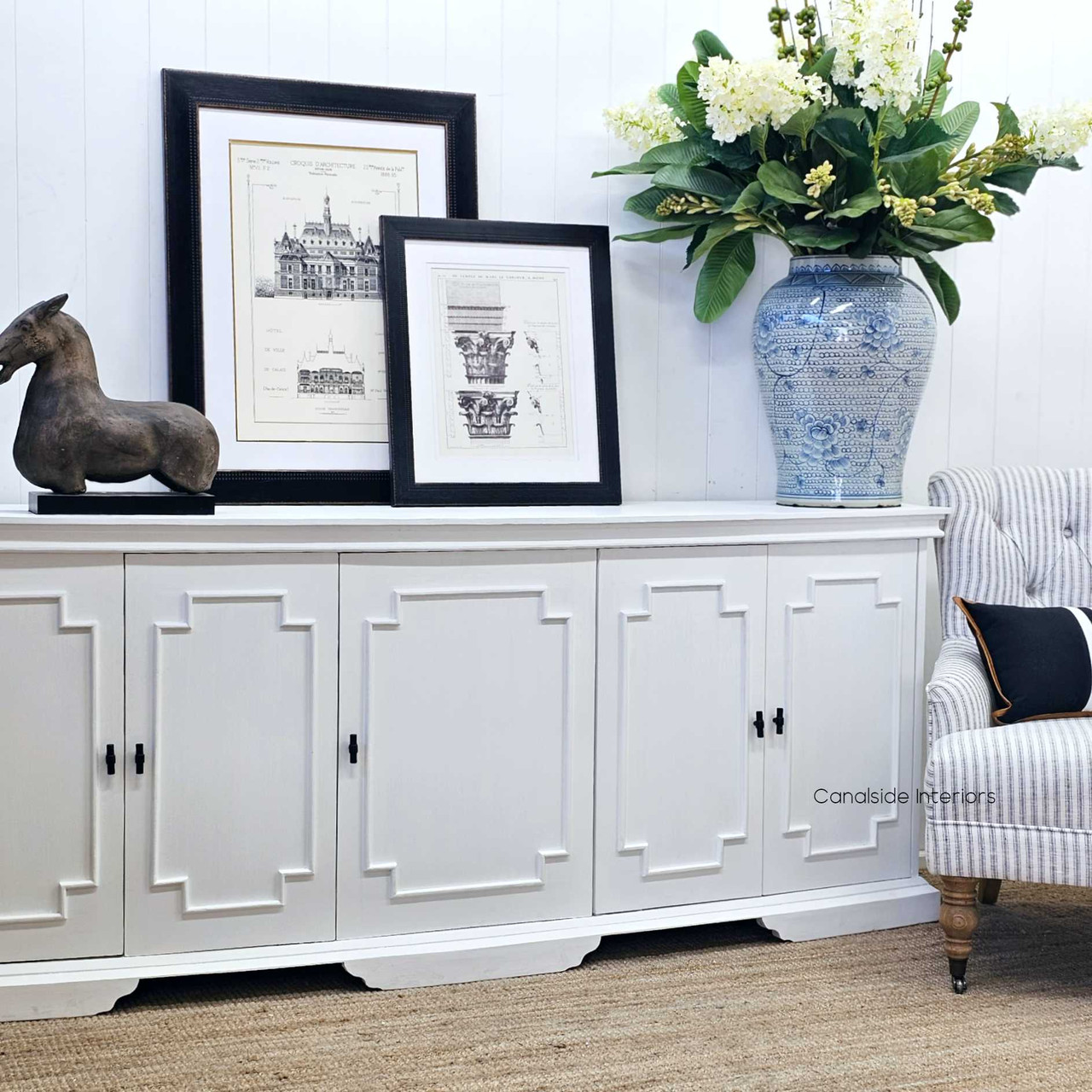 The Leontine Sideboard displayed against a modern lounge room setting, emphasizing its classic curves