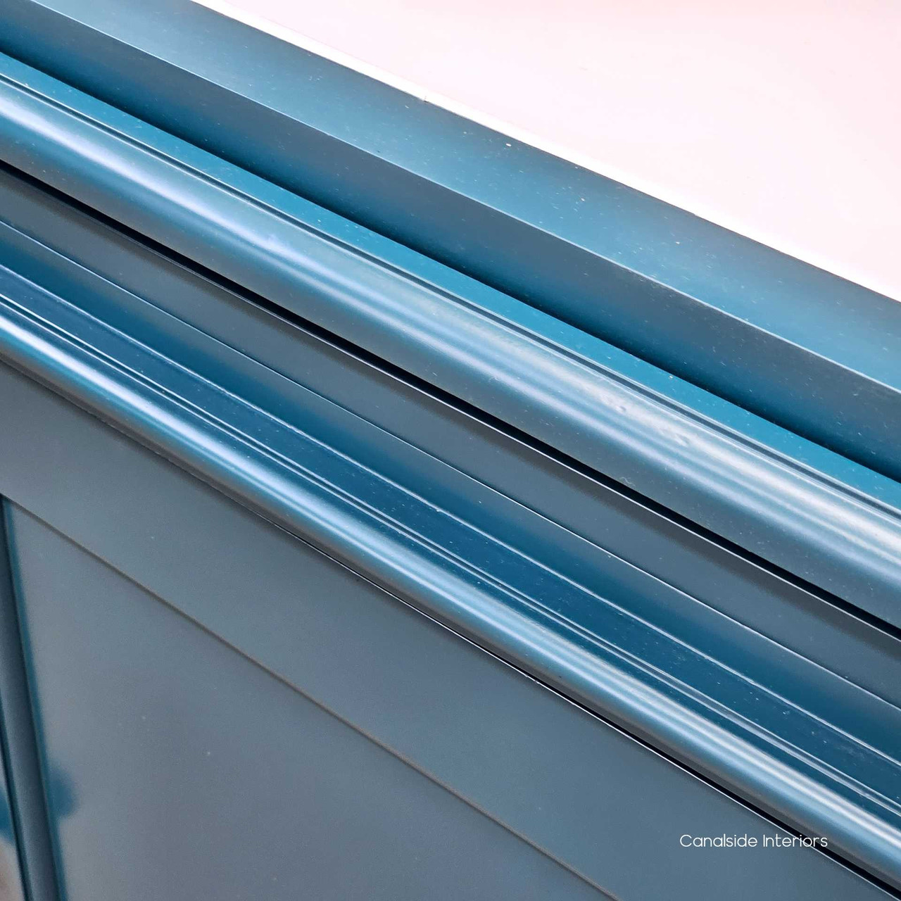 Up-close detail of the Grange Wall Unit's teal finish, a nod to quality and contemporary design trends - Canalside Interiors