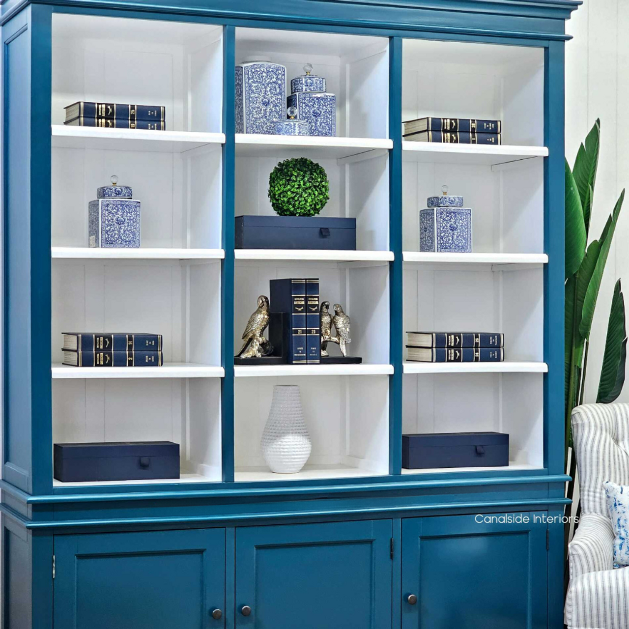 Detail shot of the Grange Wall Unit's white interior, emphasizing the clean lines and modern design - Canalside Interiors.